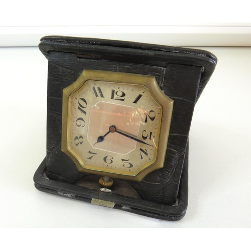 70 - Vintage Mechanical Swiss Travel clock in leather bound case.