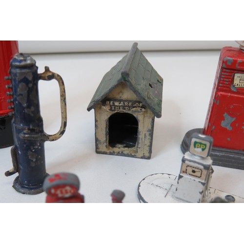 81 - Job lot of vintage lead toys including petrol pumps, Road signs, Police box etc.