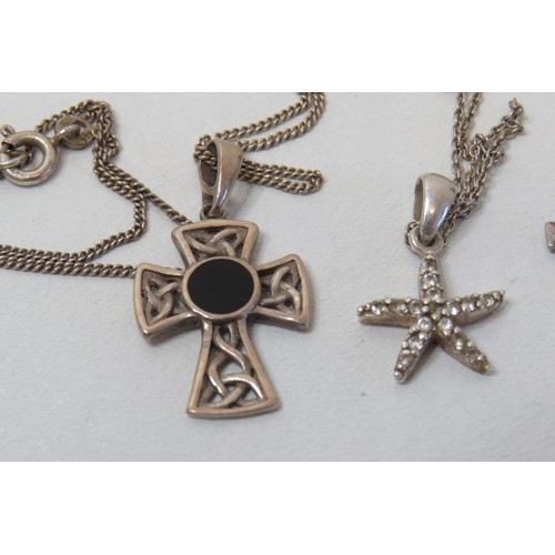 187 - Three silver necklaces - Celtic cross, crucifix and starfish.