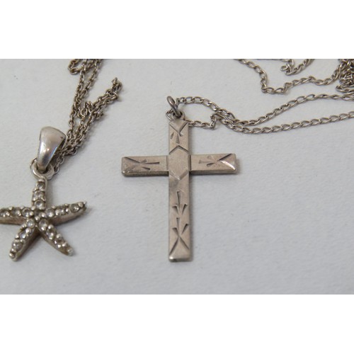 187 - Three silver necklaces - Celtic cross, crucifix and starfish.