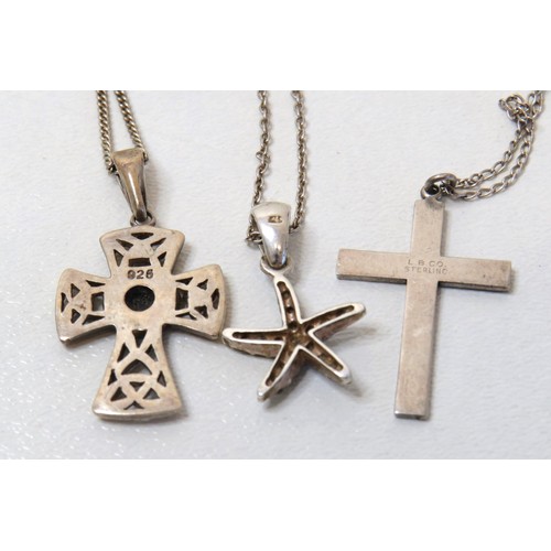 187 - Three silver necklaces - Celtic cross, crucifix and starfish.