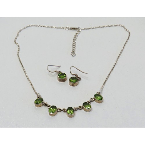 49 - Silver and Peridot necklace and earrings.