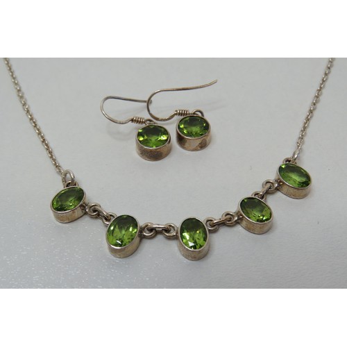 49 - Silver and Peridot necklace and earrings.