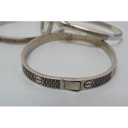 52 - Three 925 Silver bangles.
Weight 57g