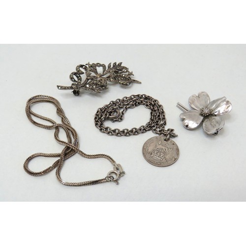 55 - Two silver brooches and two silver necklaces.