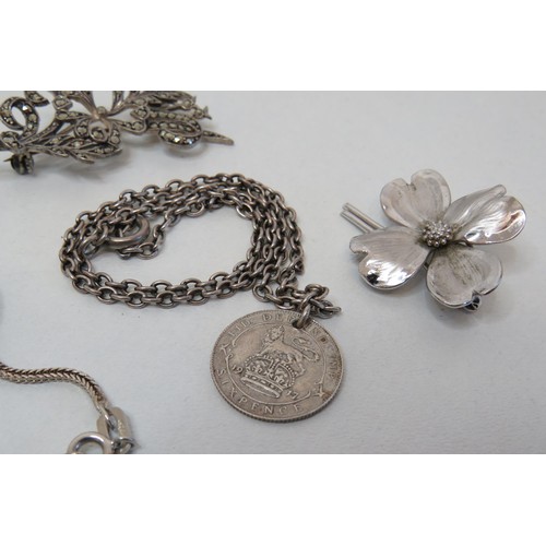 55 - Two silver brooches and two silver necklaces.