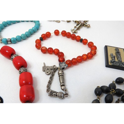 84 - Job lot of religious theme jewellery, Rosary beads, Crucifix pendants etc.