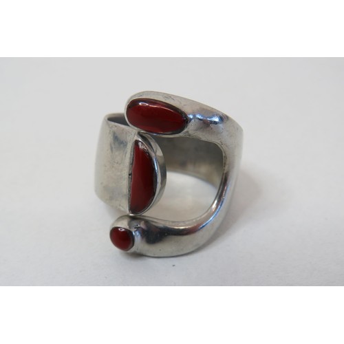 89 - 925 Sterling silver and red coral statement ring size V.
Weight 13.4g