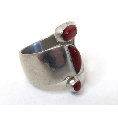 89 - 925 Sterling silver and red coral statement ring size V.
Weight 13.4g