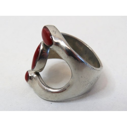 89 - 925 Sterling silver and red coral statement ring size V.
Weight 13.4g