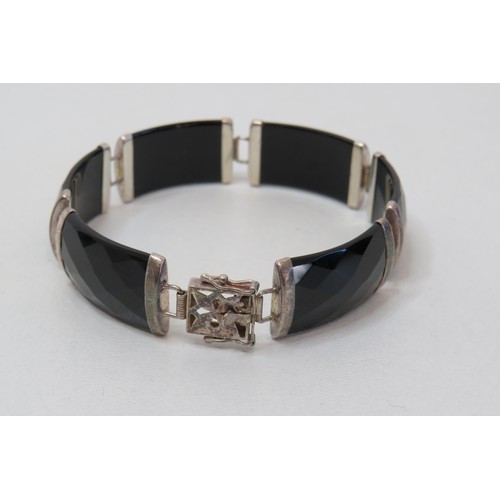 96 - Sterling silver and faceted black onyx bracelet.