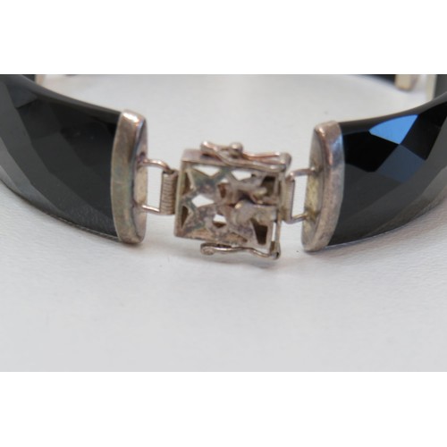 96 - Sterling silver and faceted black onyx bracelet.