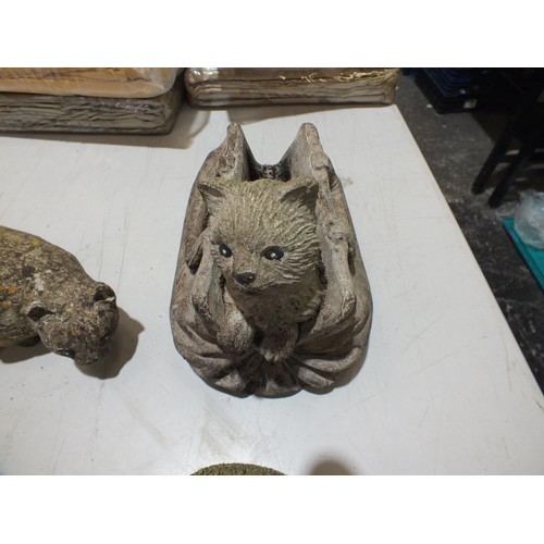 348 - Seven Concrete and stone garden ornaments as found includes cat in a bag, Rabbit, Dog by the tree, p... 