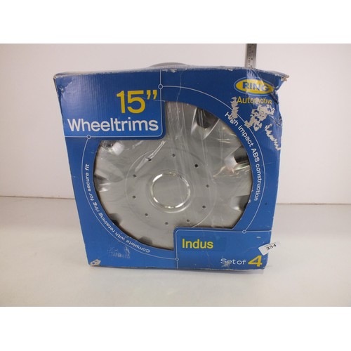 354 - Set of four boxed wheel trims - 15