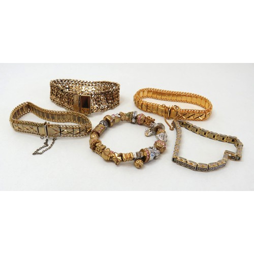 299 - Five Gold Tone bracelets including tennis bracelet.