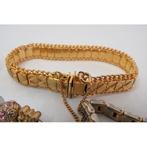 299 - Five Gold Tone bracelets including tennis bracelet.