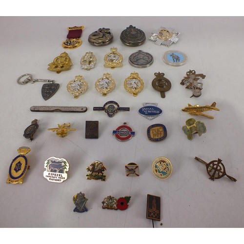 203 - Mixed lot of badges including cap badges