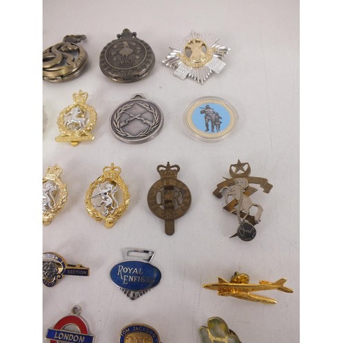 203 - Mixed lot of badges including cap badges