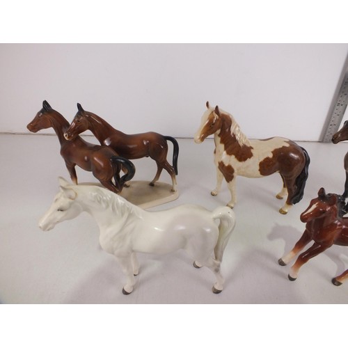 215 - Seven Porcelain horse figures to include Beswick