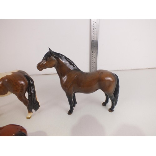 215 - Seven Porcelain horse figures to include Beswick