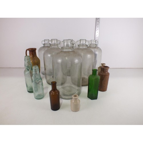 360 - Six demi john bottles, glass bottle, stoneware etc