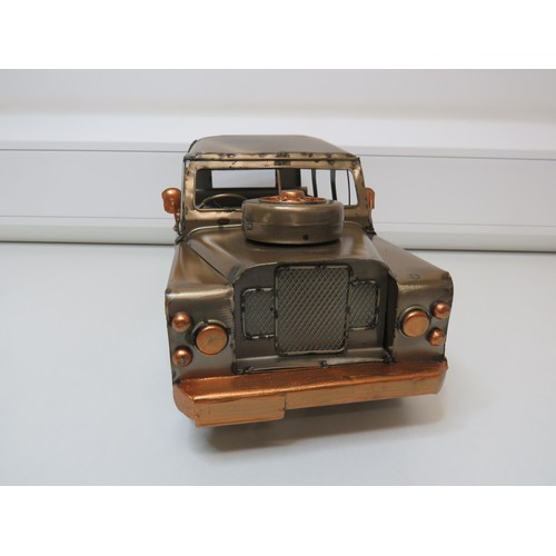 163 - Tin plate Land Rover.