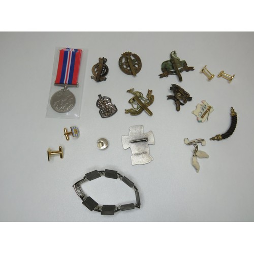 131 - Two silver A.R.P air raid badges, cap badge, medal etc.