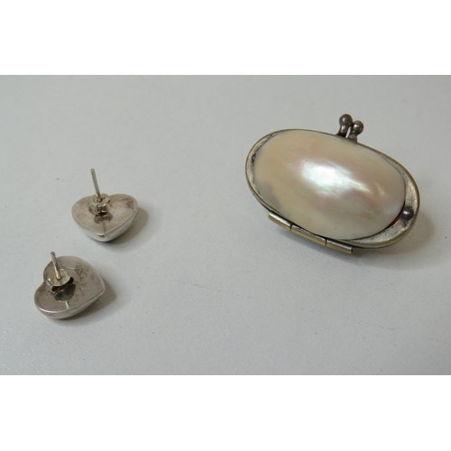 256 - Shell case and pair of silver earrings.