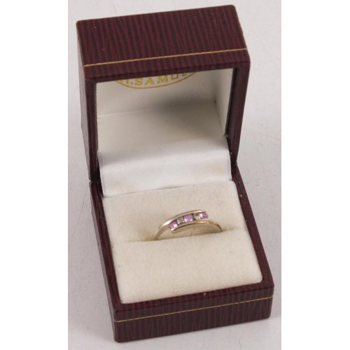 227 - White gold eternity ring with pink stones and diamond - marked 375