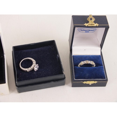 228 - Four boxed silver rings