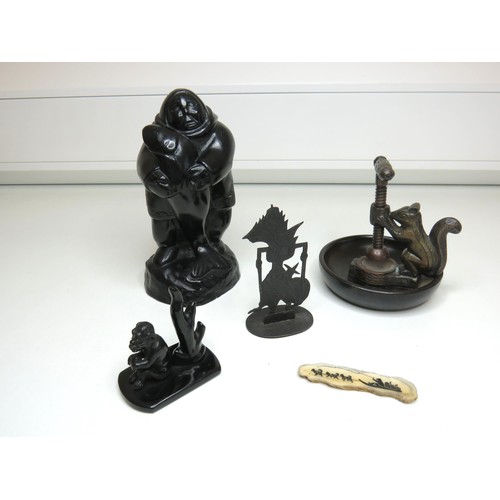 448 - Mixed lot of collectables to include brass and treen squirrel nut cracker, carved wooden eskimo and ... 