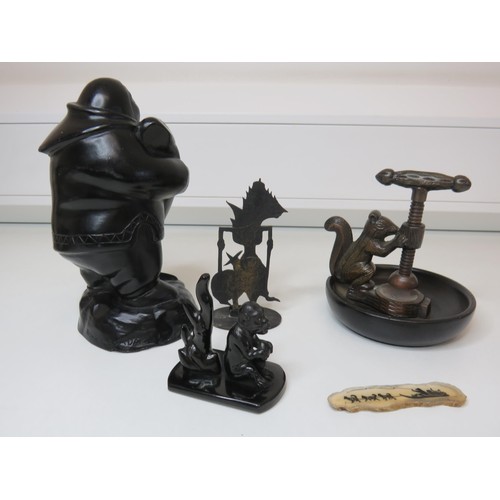 448 - Mixed lot of collectables to include brass and treen squirrel nut cracker, carved wooden eskimo and ... 