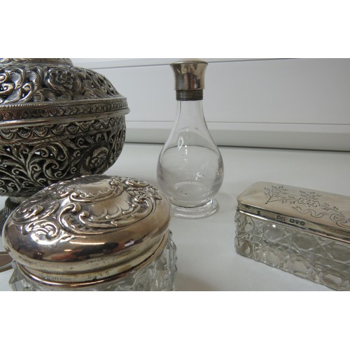 204 - Silver top bottle and jars, pot pourri container, lorgnette etc