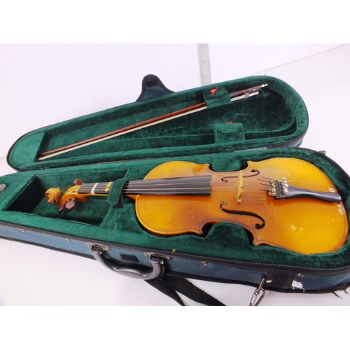 106 - Violin with bow in fitted case.