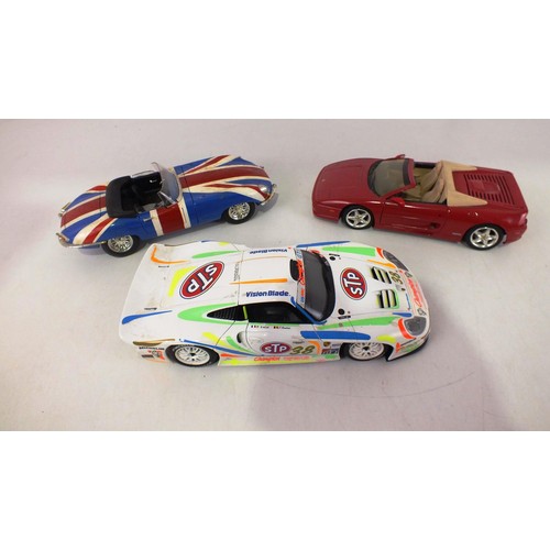 85 - Three 1/18 scale model cars.