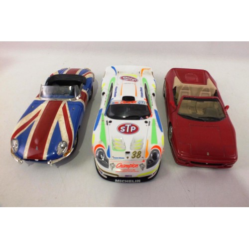 85 - Three 1/18 scale model cars.