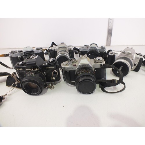 95 - Six vintage camera's with lens to include Canon and Pentax.