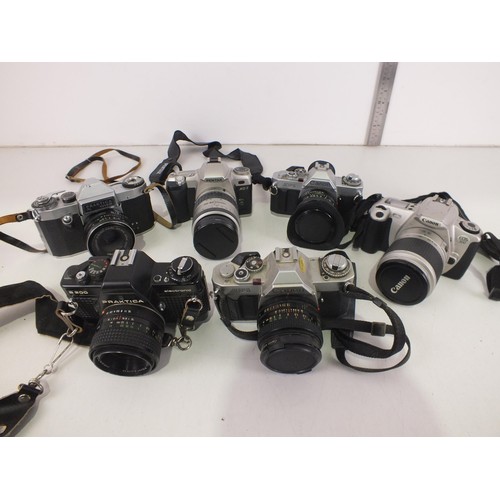 95 - Six vintage camera's with lens to include Canon and Pentax.