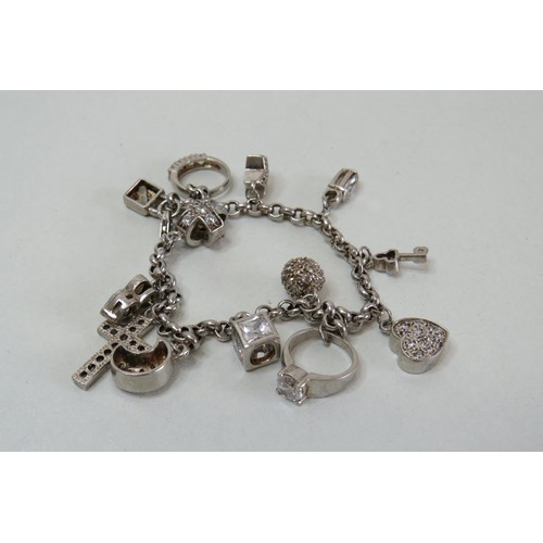 214 - Sterling silver charm bracelet with fourteen charms.