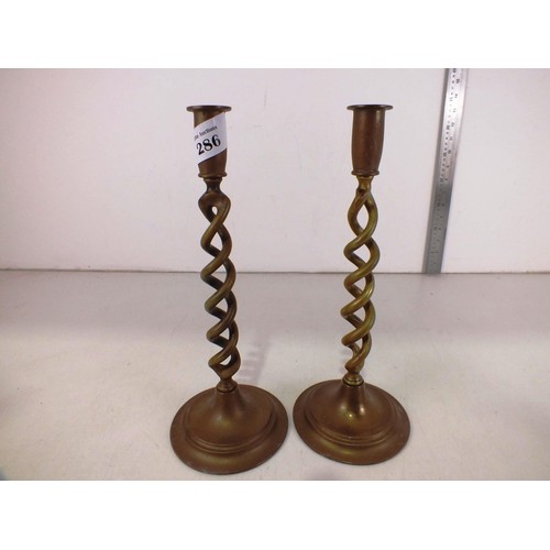 286 - A pair of vintage brass barley twist candlesticks.