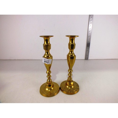 287 - A pair of large brass candlesticks.