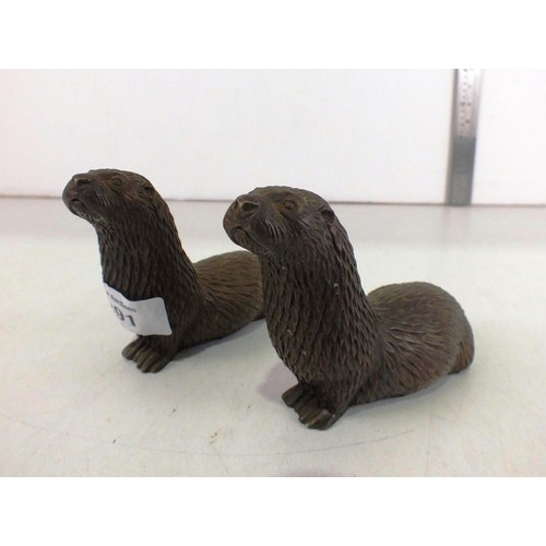 291 - A pair of bronzed resin otter's.