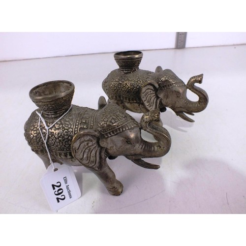 292 - A pair of Asian metal elephant candle holders.