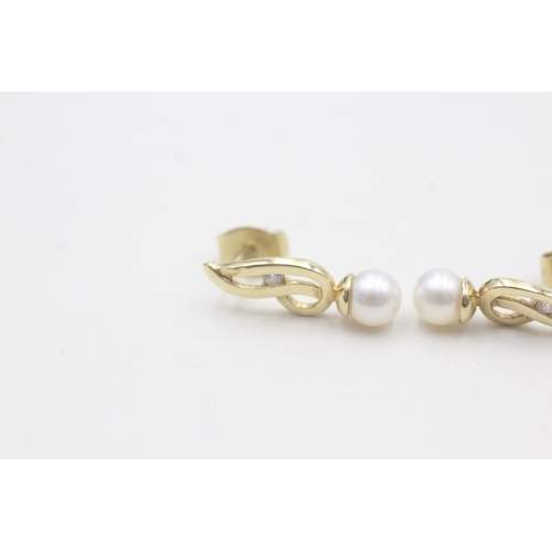 520 - 9ct gold cultured pearl stud earrings (1.3g)