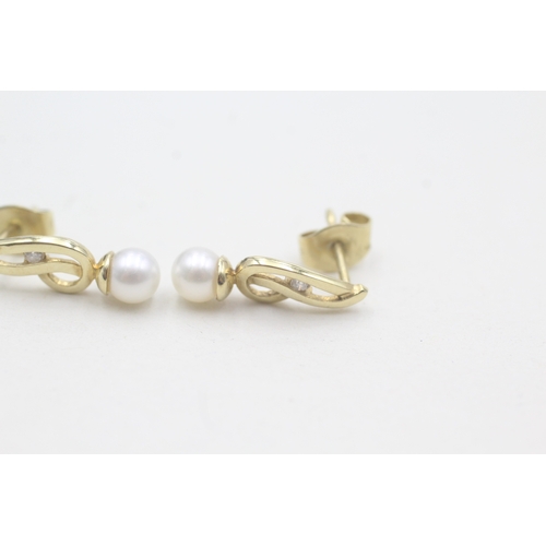 520 - 9ct gold cultured pearl stud earrings (1.3g)