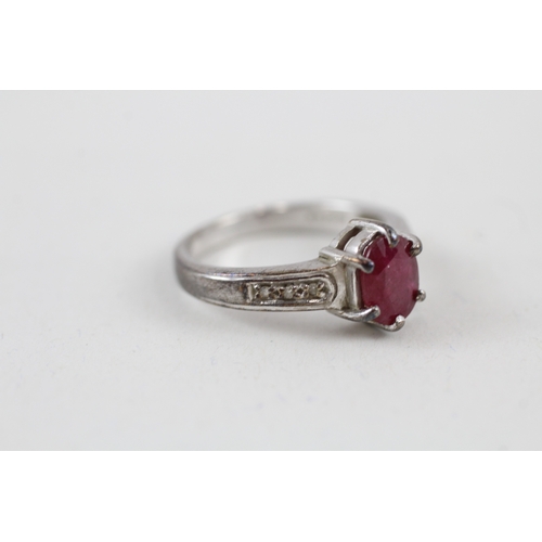 540 - 9ct white gold glass filled ruby solitaire dress ring with diamond set shoulders (3.6g) size N.