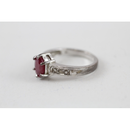 540 - 9ct white gold glass filled ruby solitaire dress ring with diamond set shoulders (3.6g) size N.