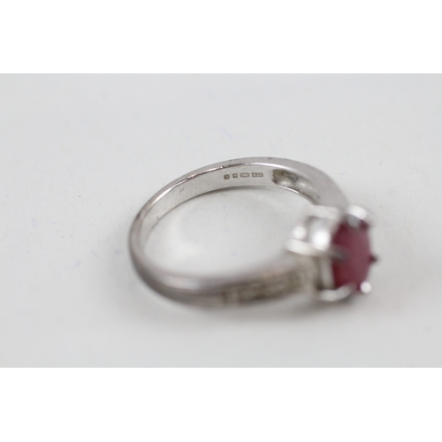 540 - 9ct white gold glass filled ruby solitaire dress ring with diamond set shoulders (3.6g) size N.