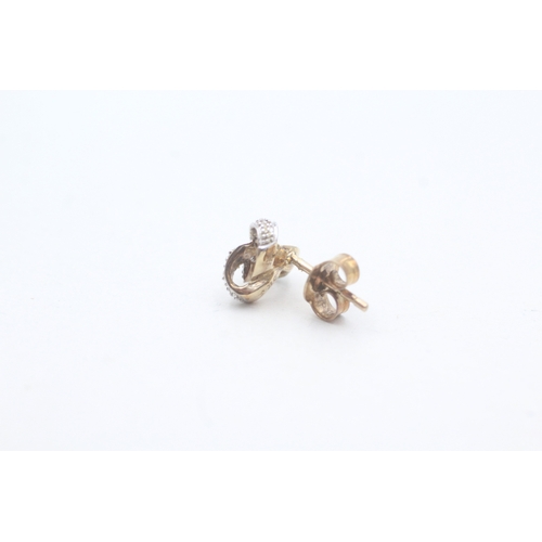 549 - 9ct gold and diamond stud earrings (1.6g)