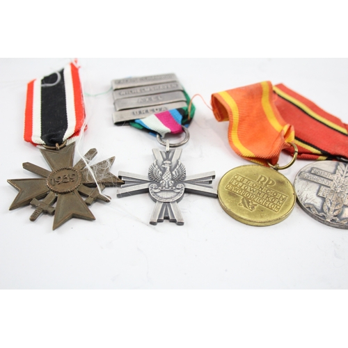 574 - Six Medals Including WW2 German Merit Cross with Swords, Polish & Russian